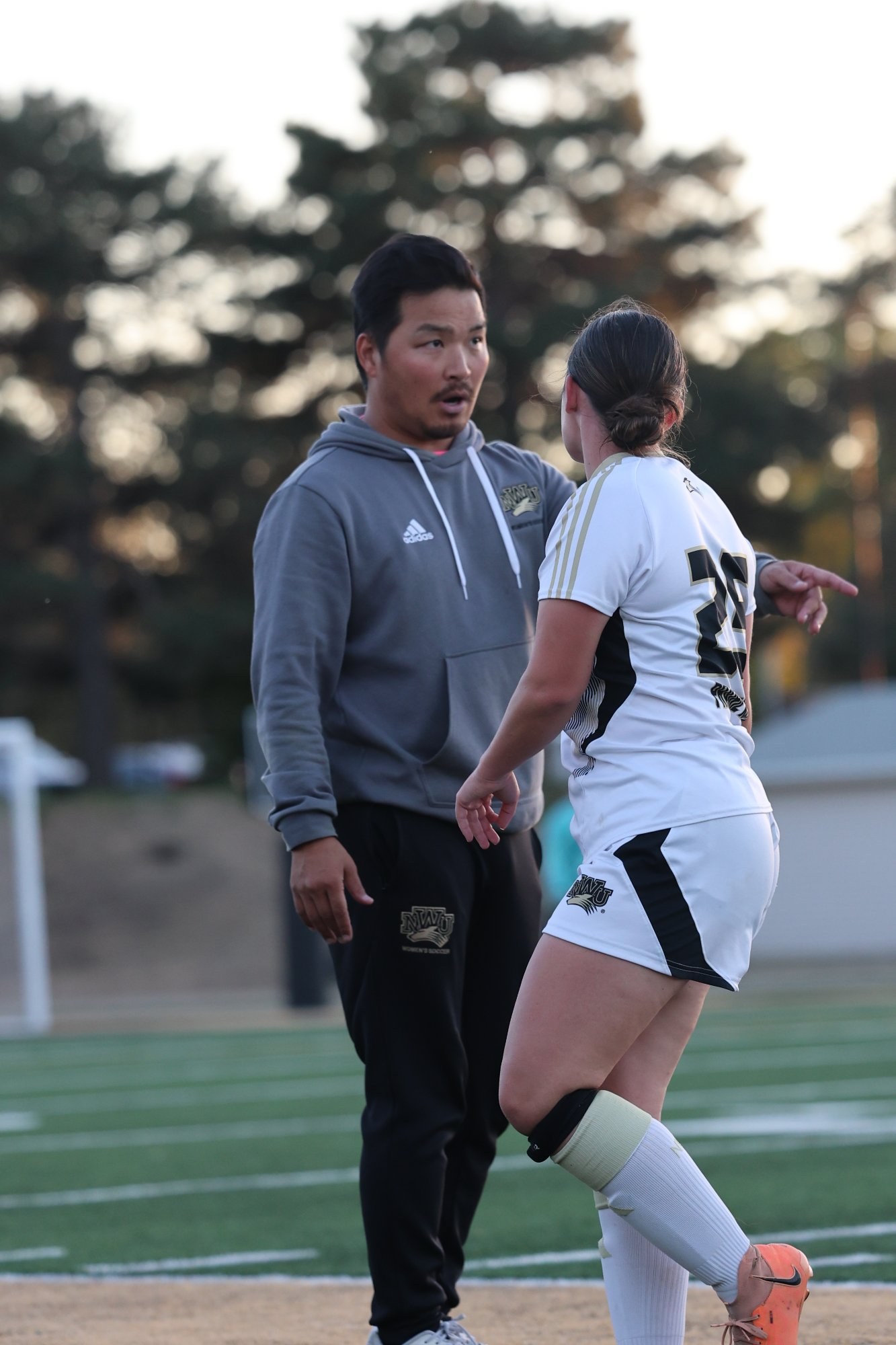 Eryn Marshall receiving coaching on the sideline